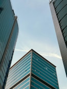 A couple of tall buildings sitting next to each other