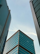 A couple of tall buildings sitting next to each other