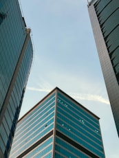 A couple of tall buildings sitting next to each other