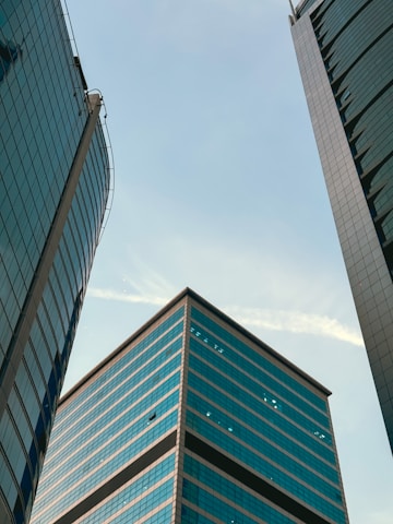 A couple of tall buildings sitting next to each other