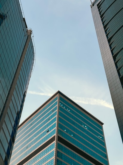 A couple of tall buildings sitting next to each other