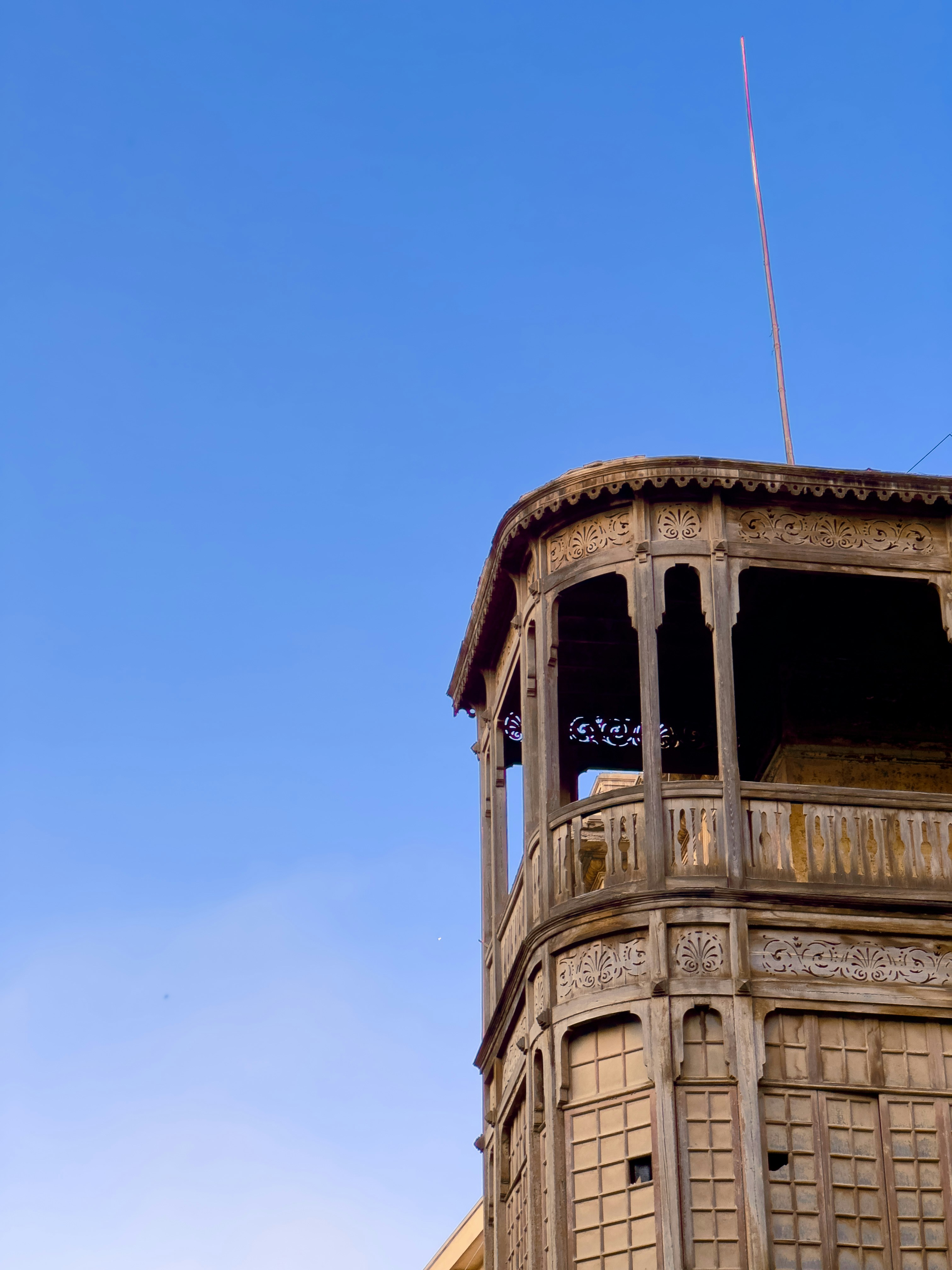 A tall building with a clock on the top of it