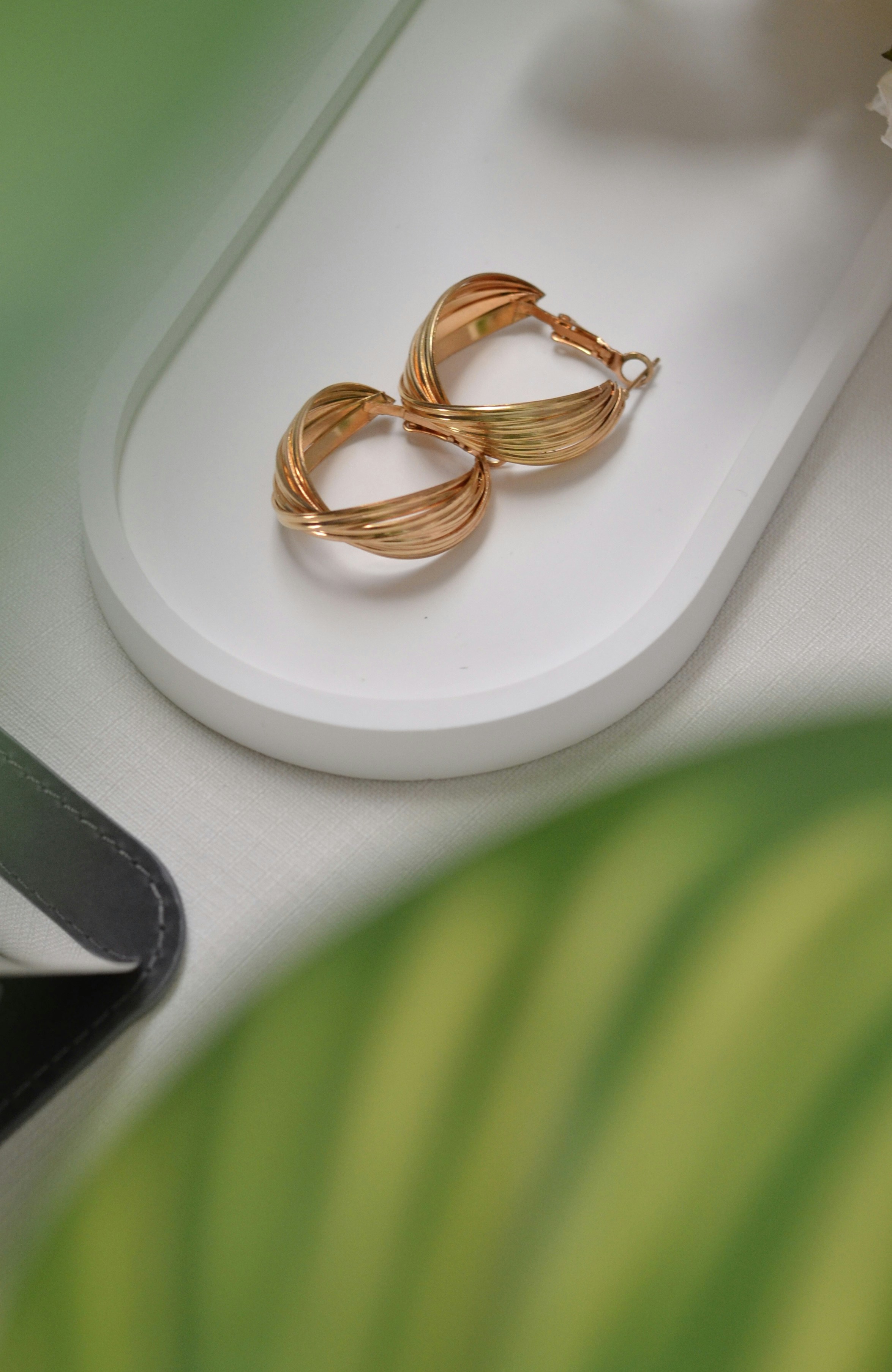 A close up of a pair of earrings on a table