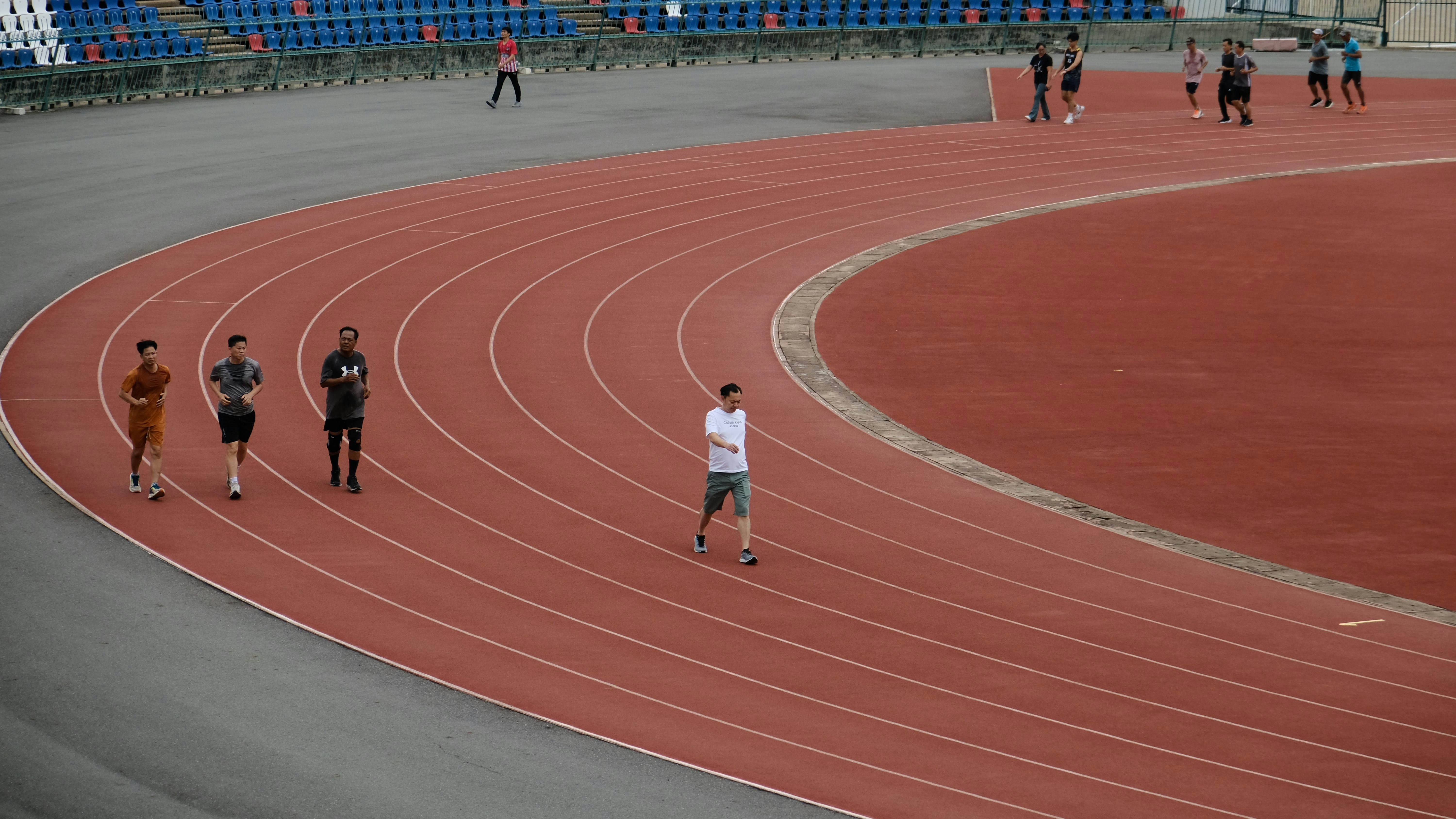Athletes sprinting on track