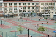 A group of people playing a game of basketball