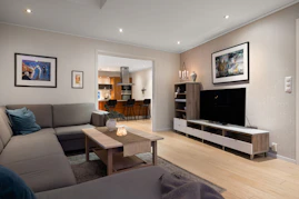 A living room filled with furniture and a flat screen TV