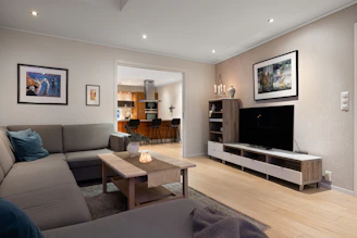 A living room filled with furniture and a flat screen TV