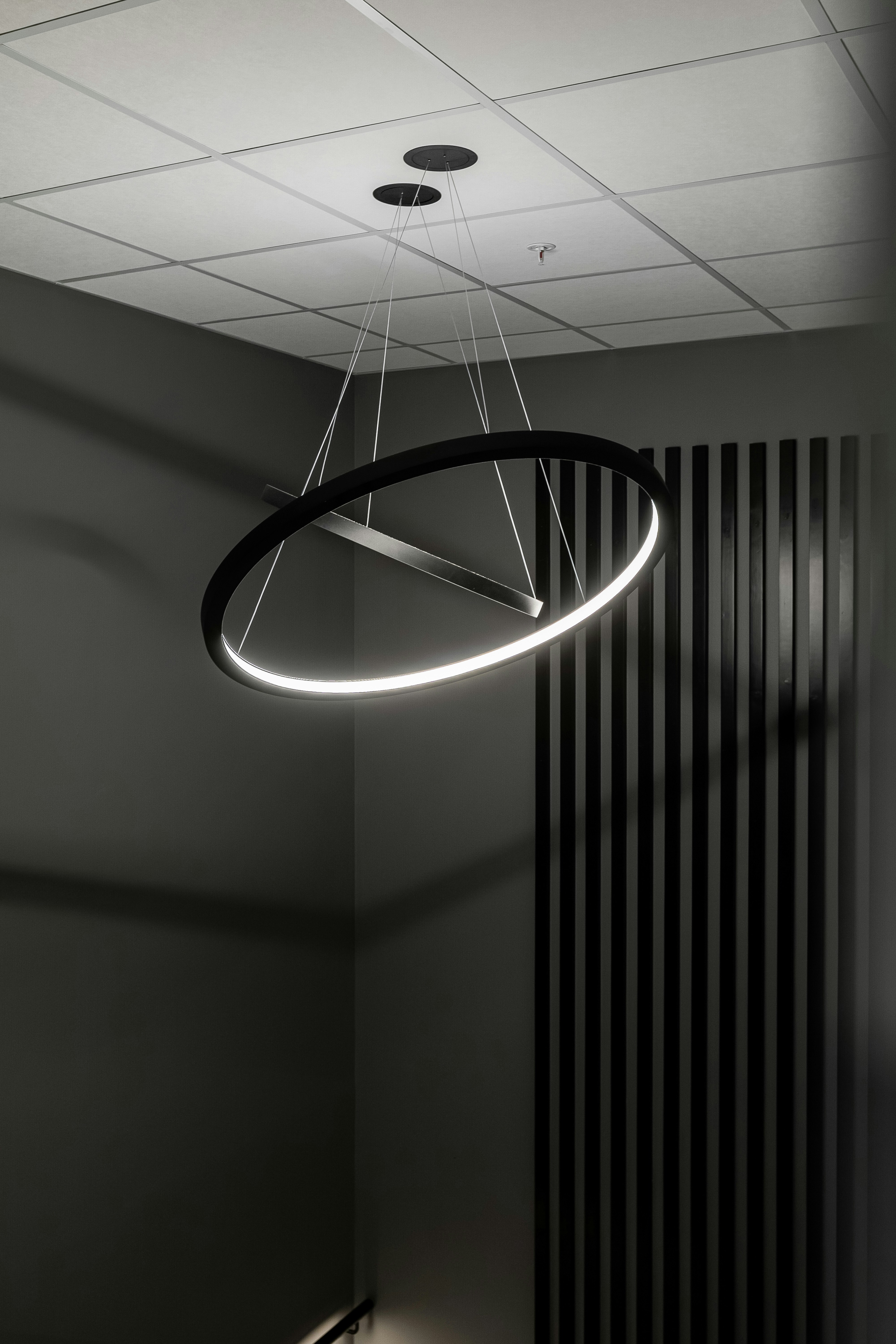 A circular light fixture hanging from a ceiling photo – Free Interior ...