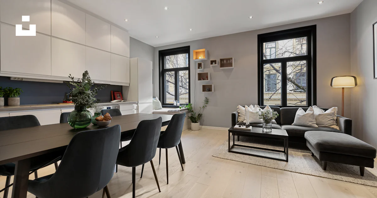 A living room filled with furniture and lots of windows photo – Free ...