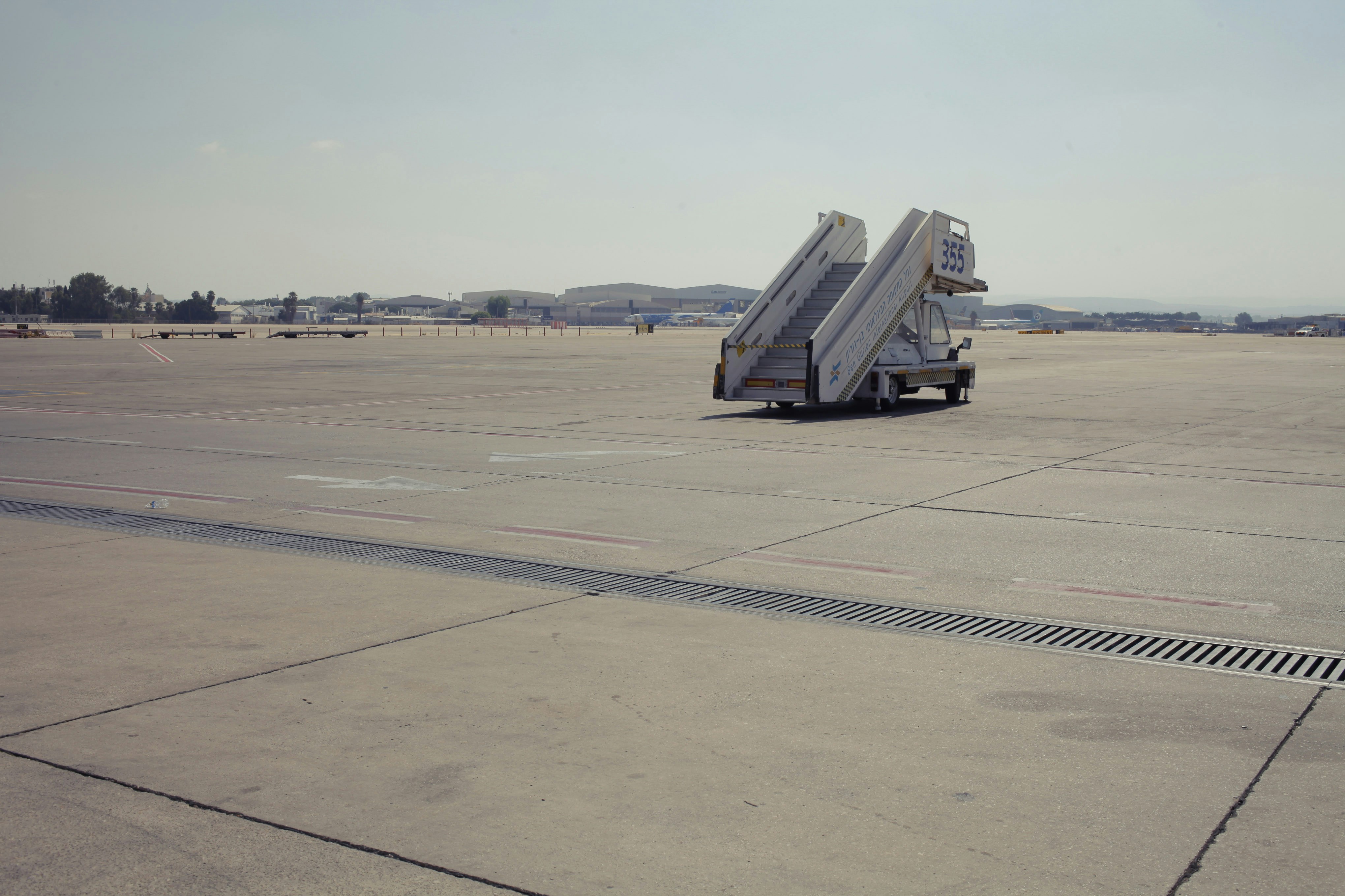 A large airplane sitting on top of an airport tarmac