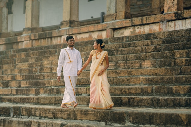 A man and a woman walking down some steps
