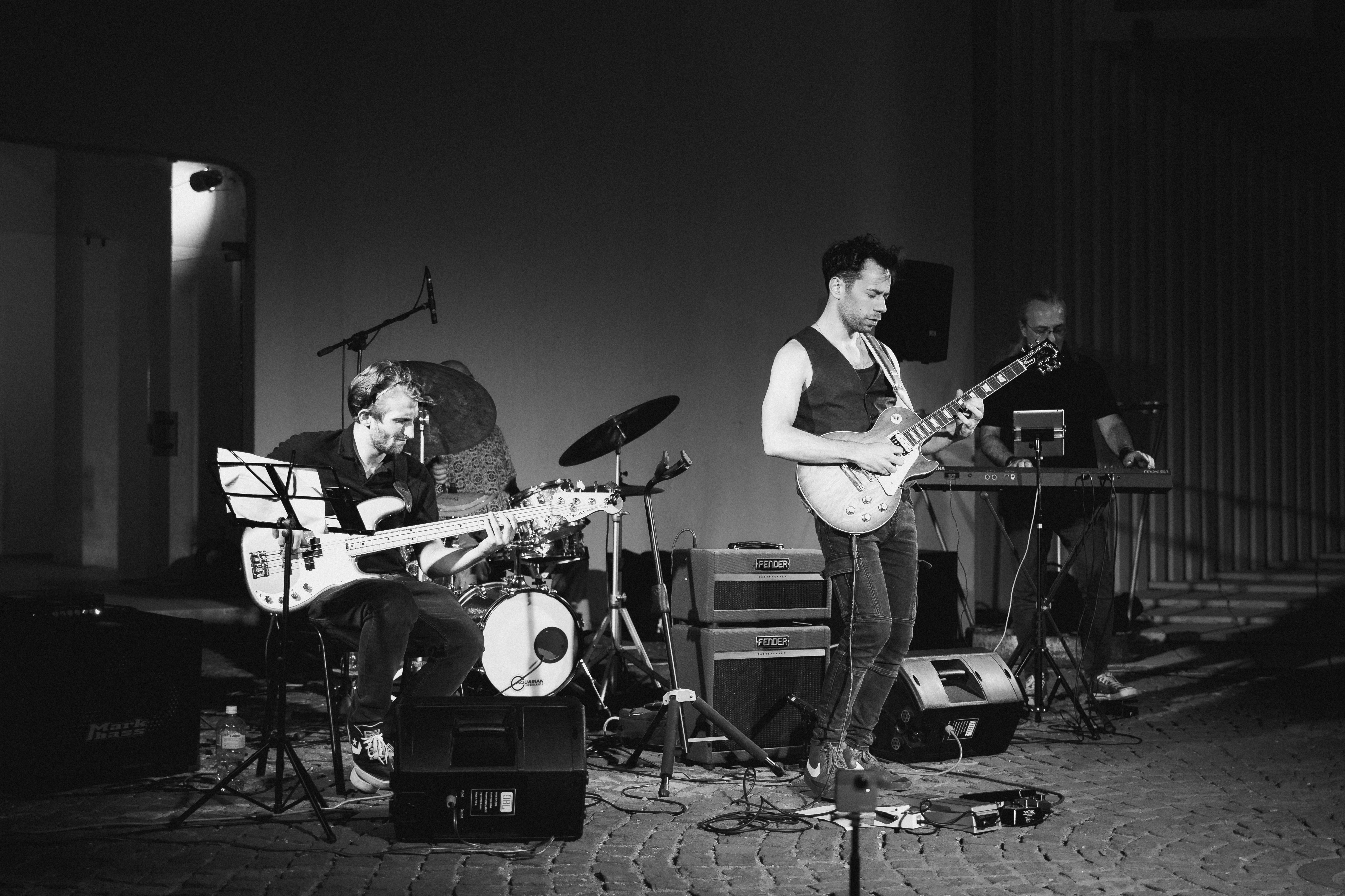 A black and white photo of a band playing