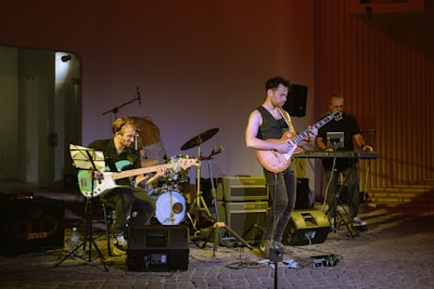 A group of people that are playing guitars