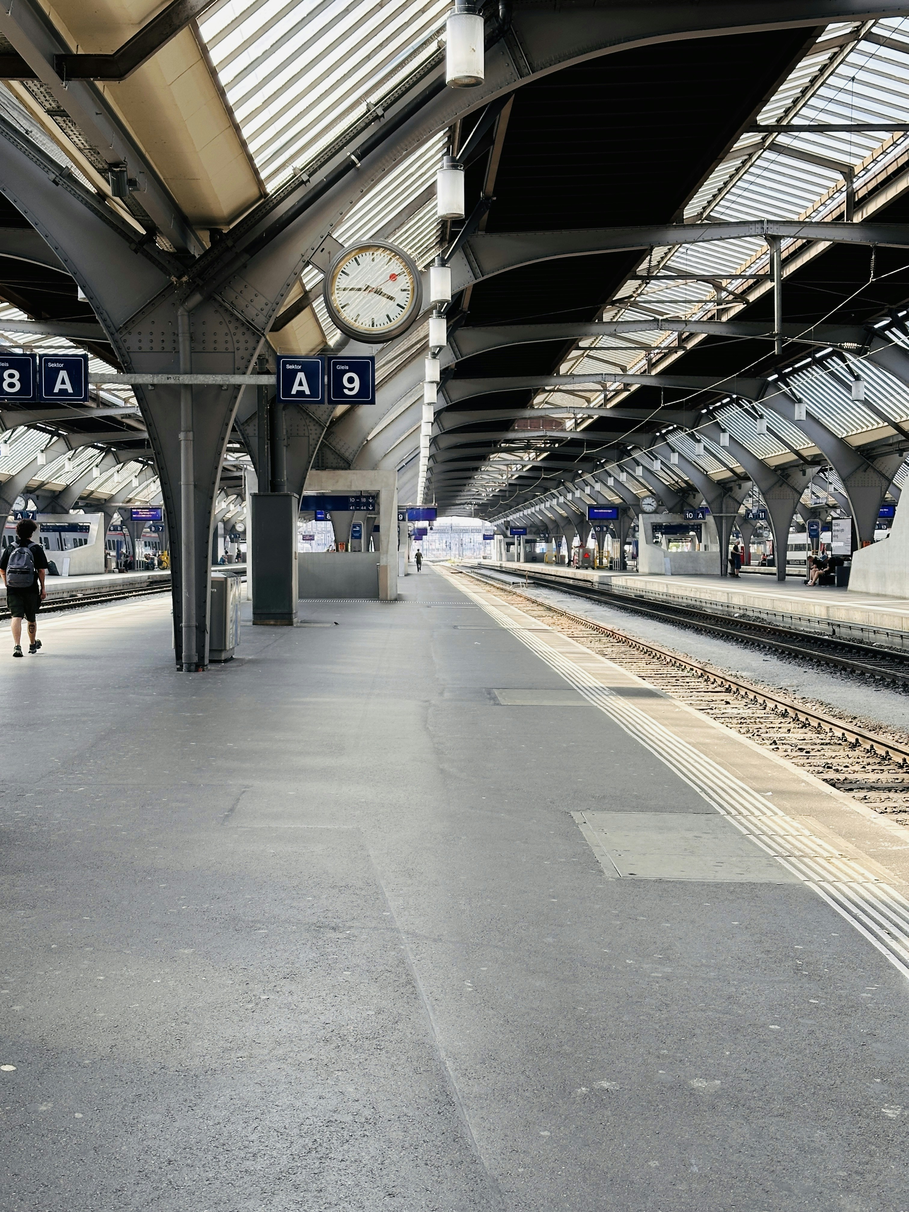 A train station with a clock on the wall
