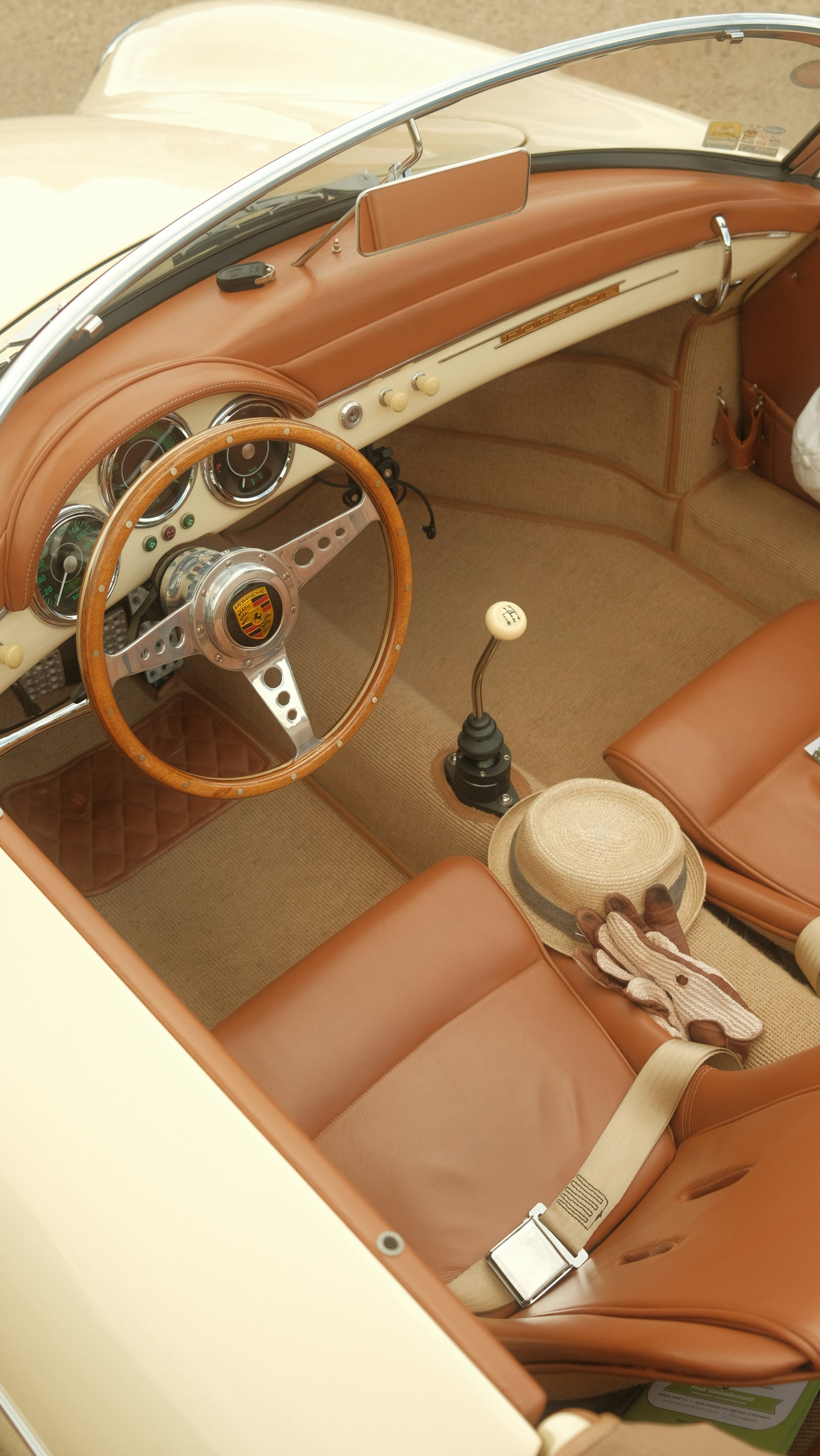 The interior of a car with a steering wheel and dashboard