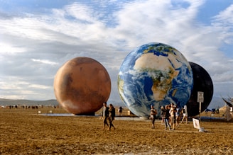 A group of people walking across a field