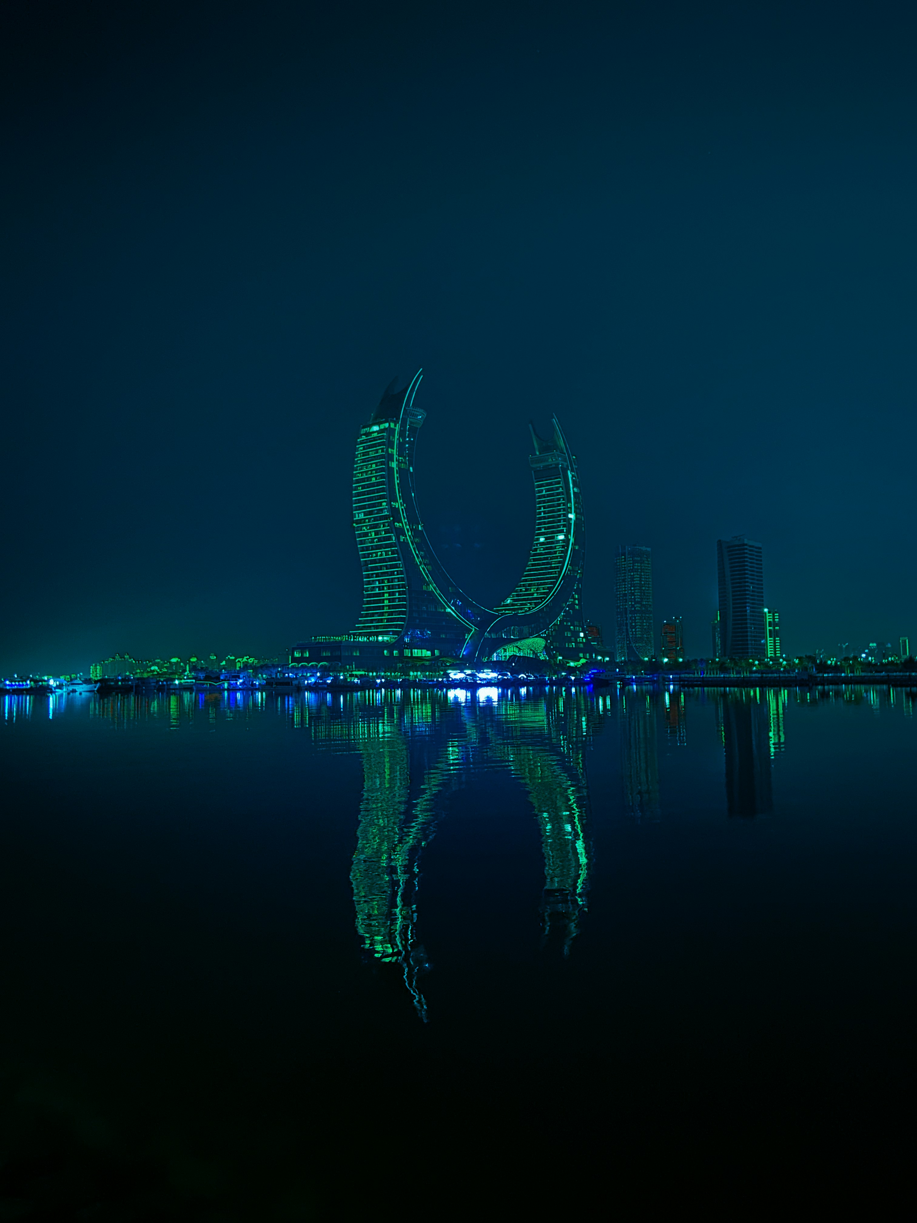 A large body of water with a city in the background