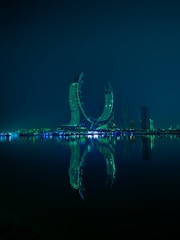 A large body of water with a city in the background