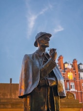A statue of a man holding a pipe