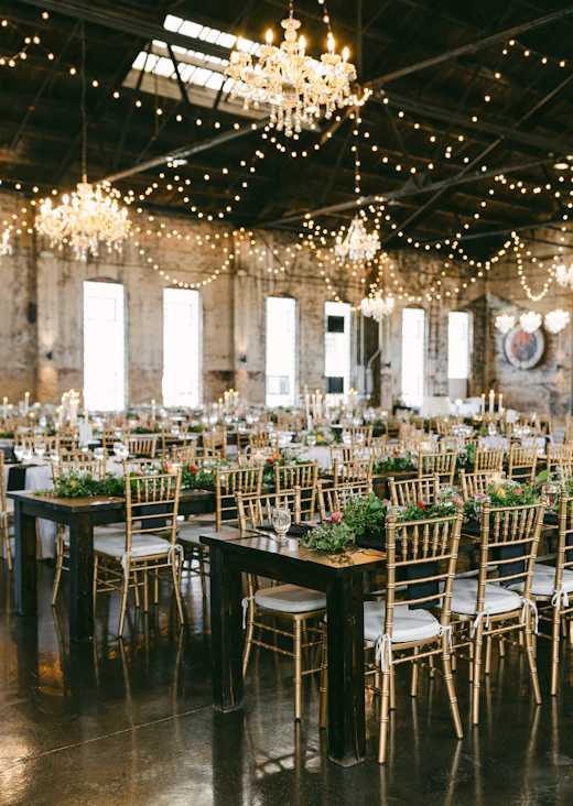 A reception room filled with tables and chairs