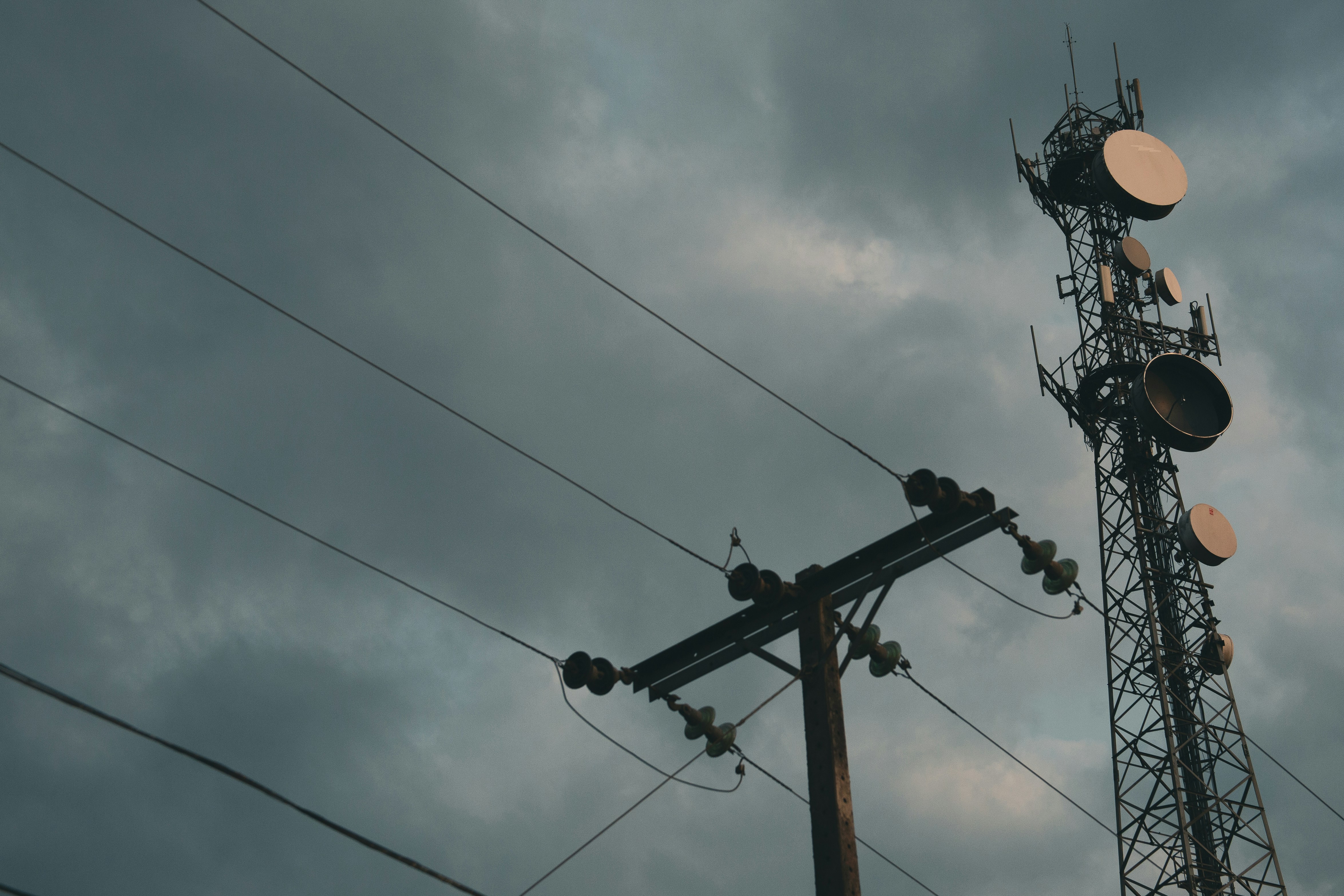 A telephone pole with a lot of lights on top of it