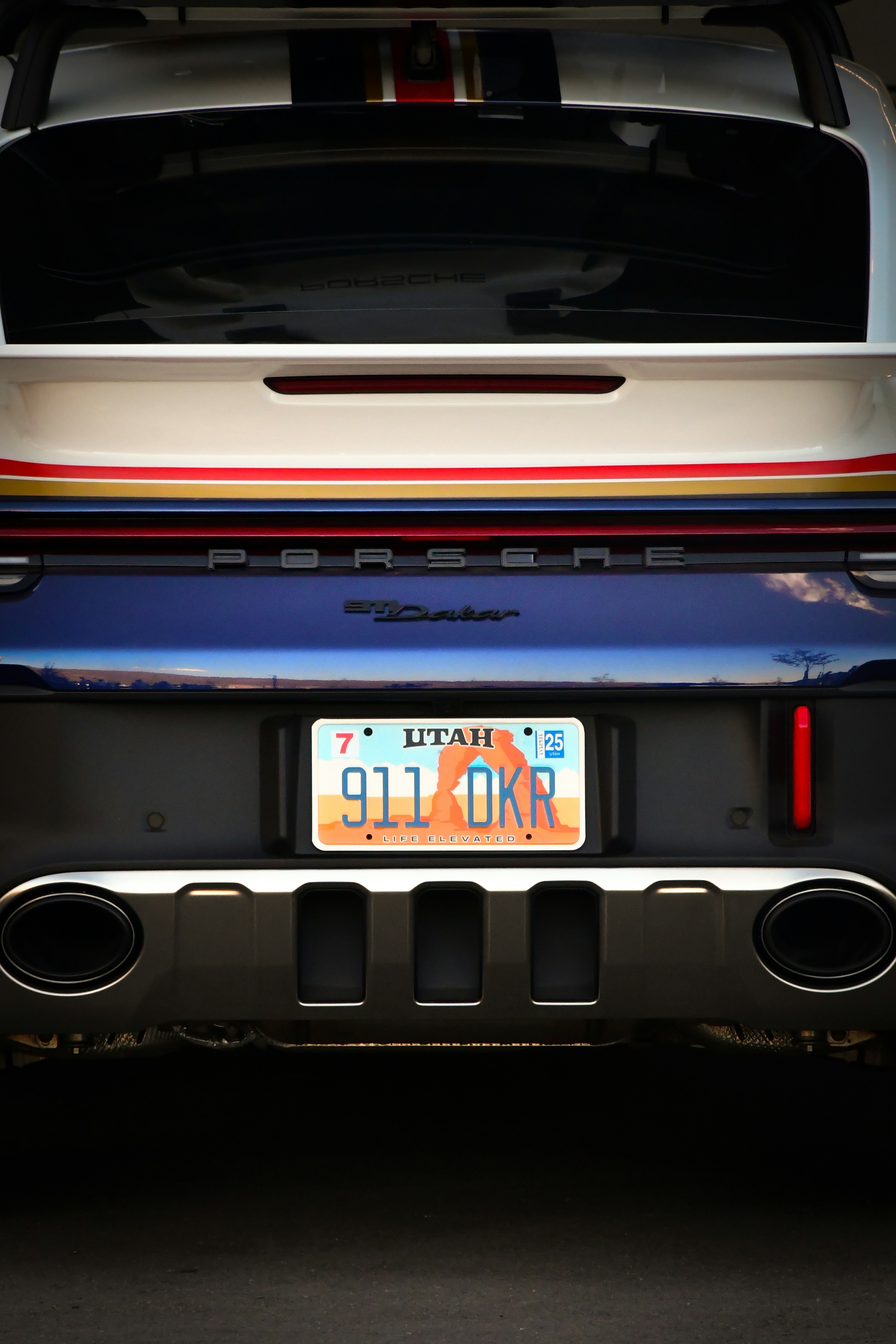 The back end of a car with a license plate