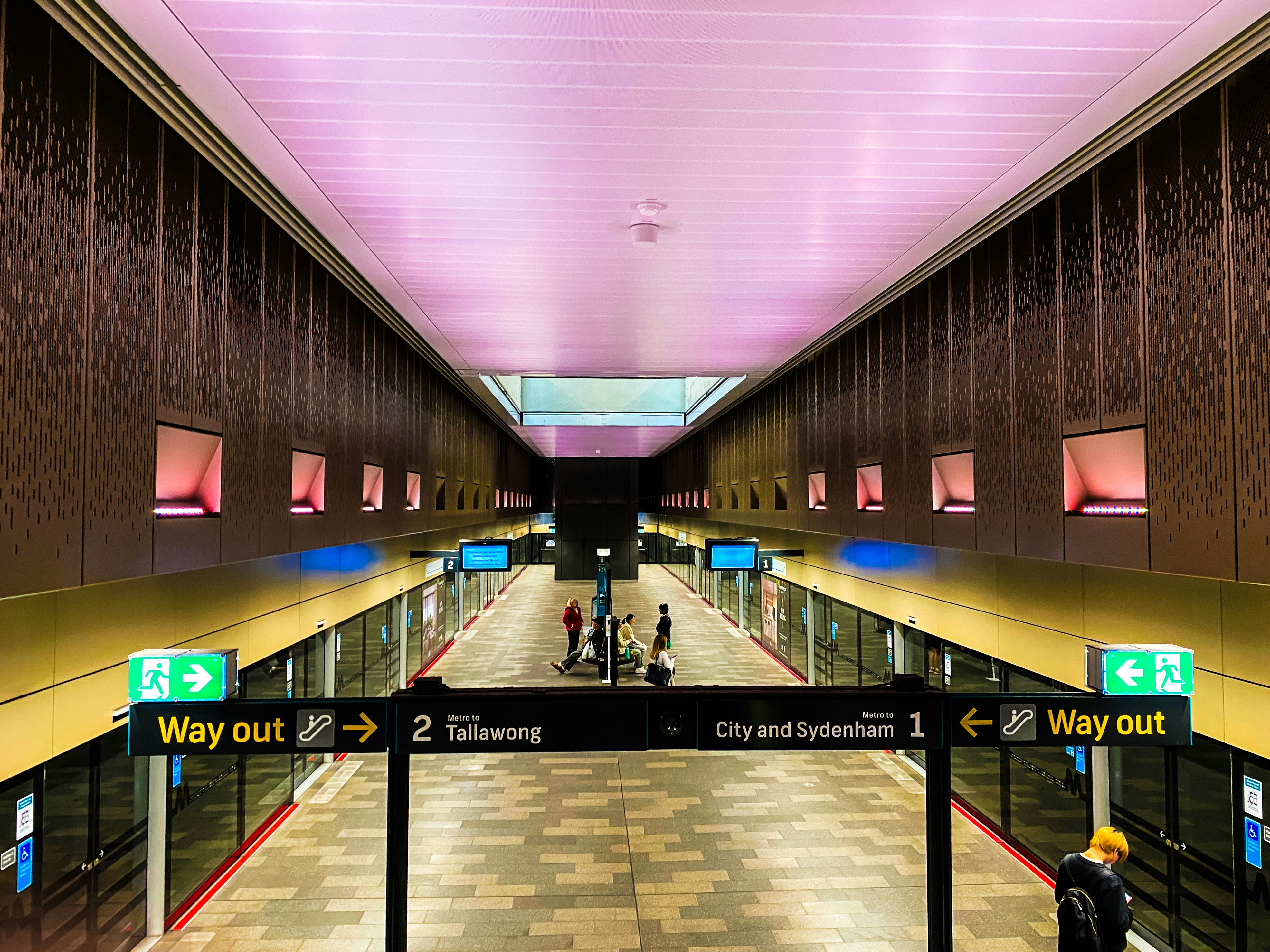 A train station with a few people on the platform, International Student Navigator Australia: Nestled in the bustling heart of Sydney, George Street is more than just a thoroughfare—it