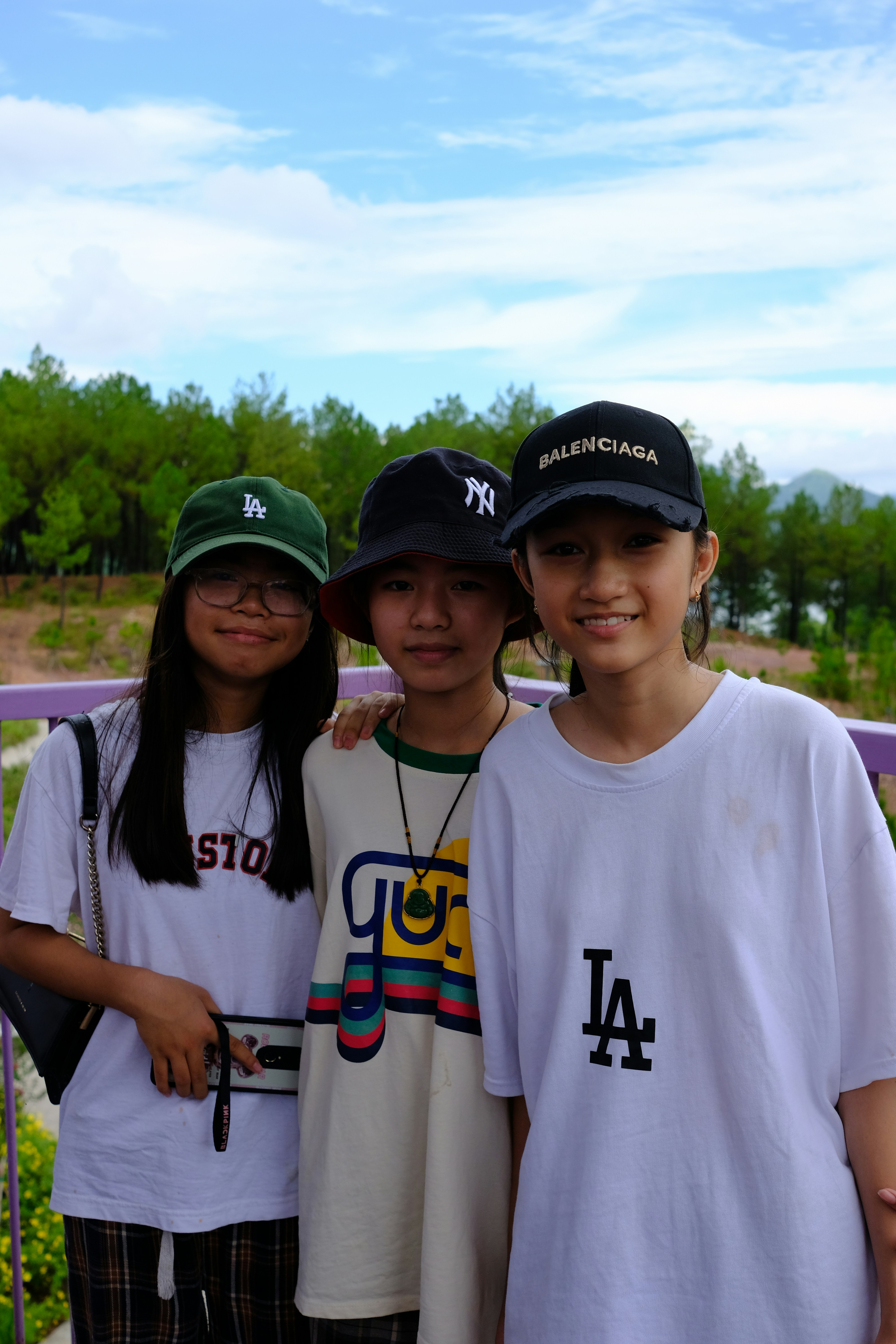 A group of young people standing next to each other