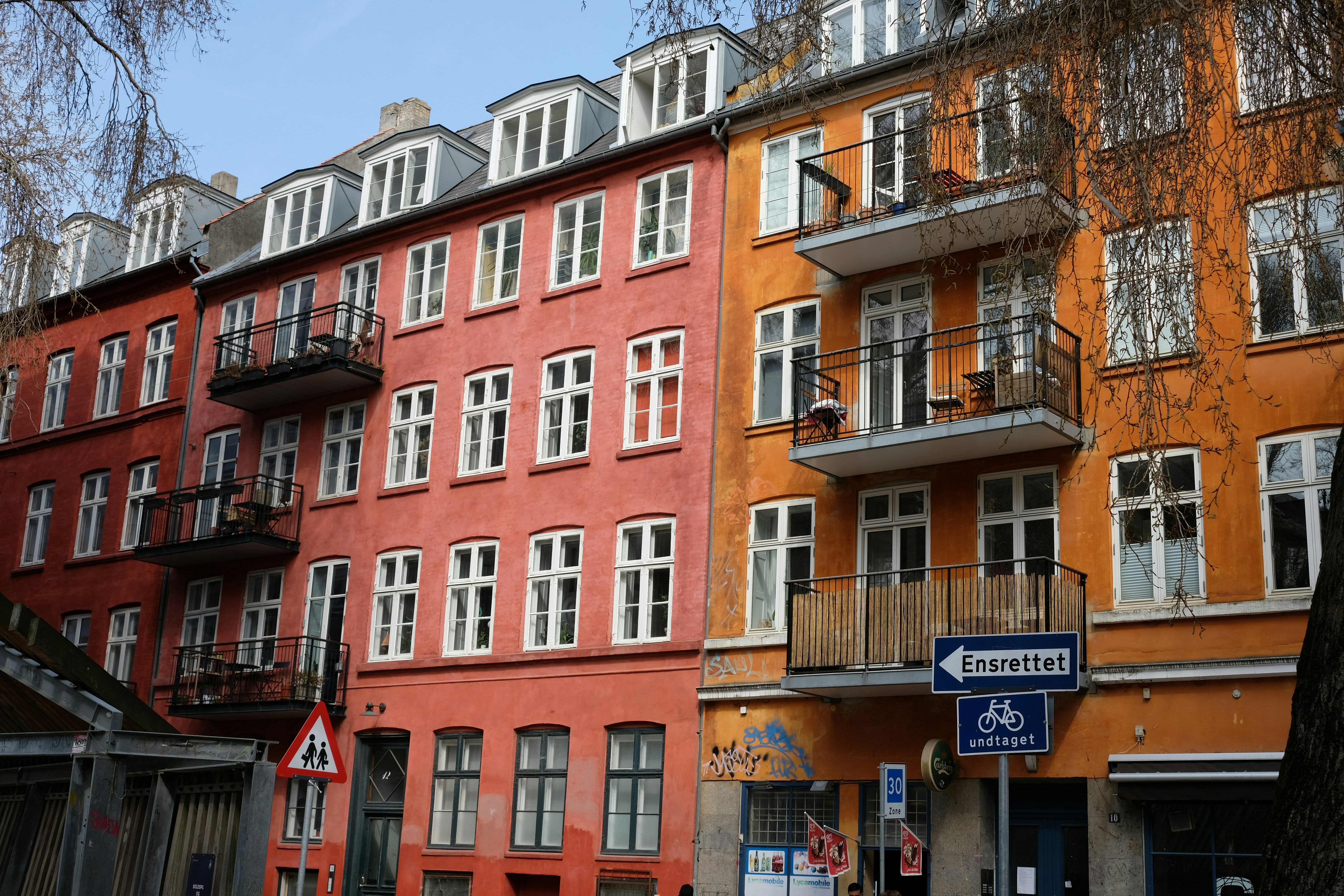 A row of multicolored buildings in a city
