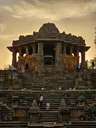 A group of people standing on top of a stone structure