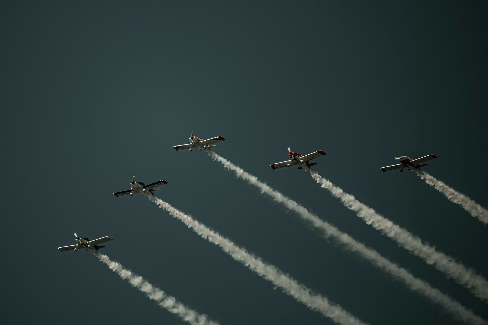 A group of airplanes flying in formation in the sky