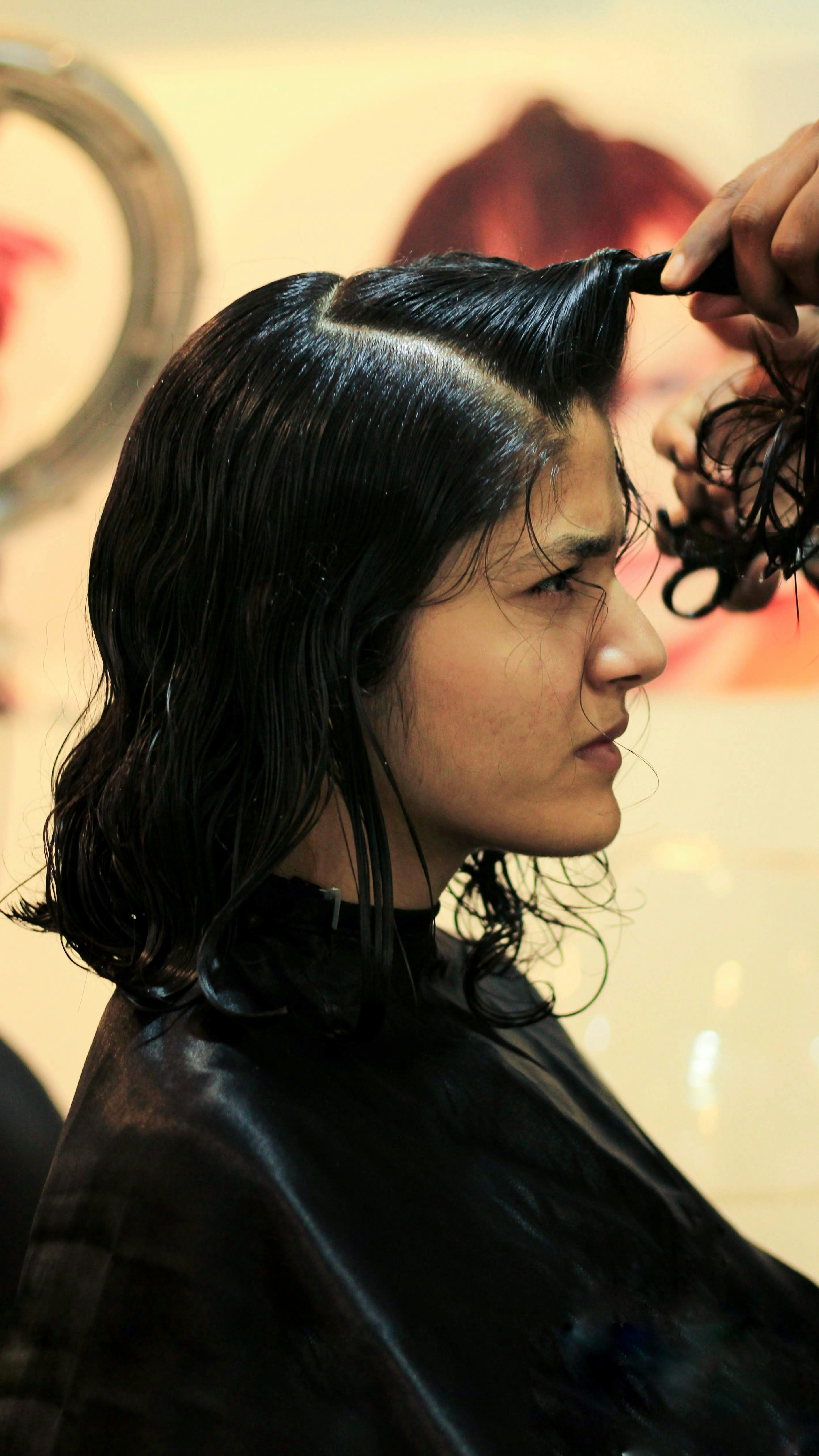 a woman getting an ultimate bob haircut