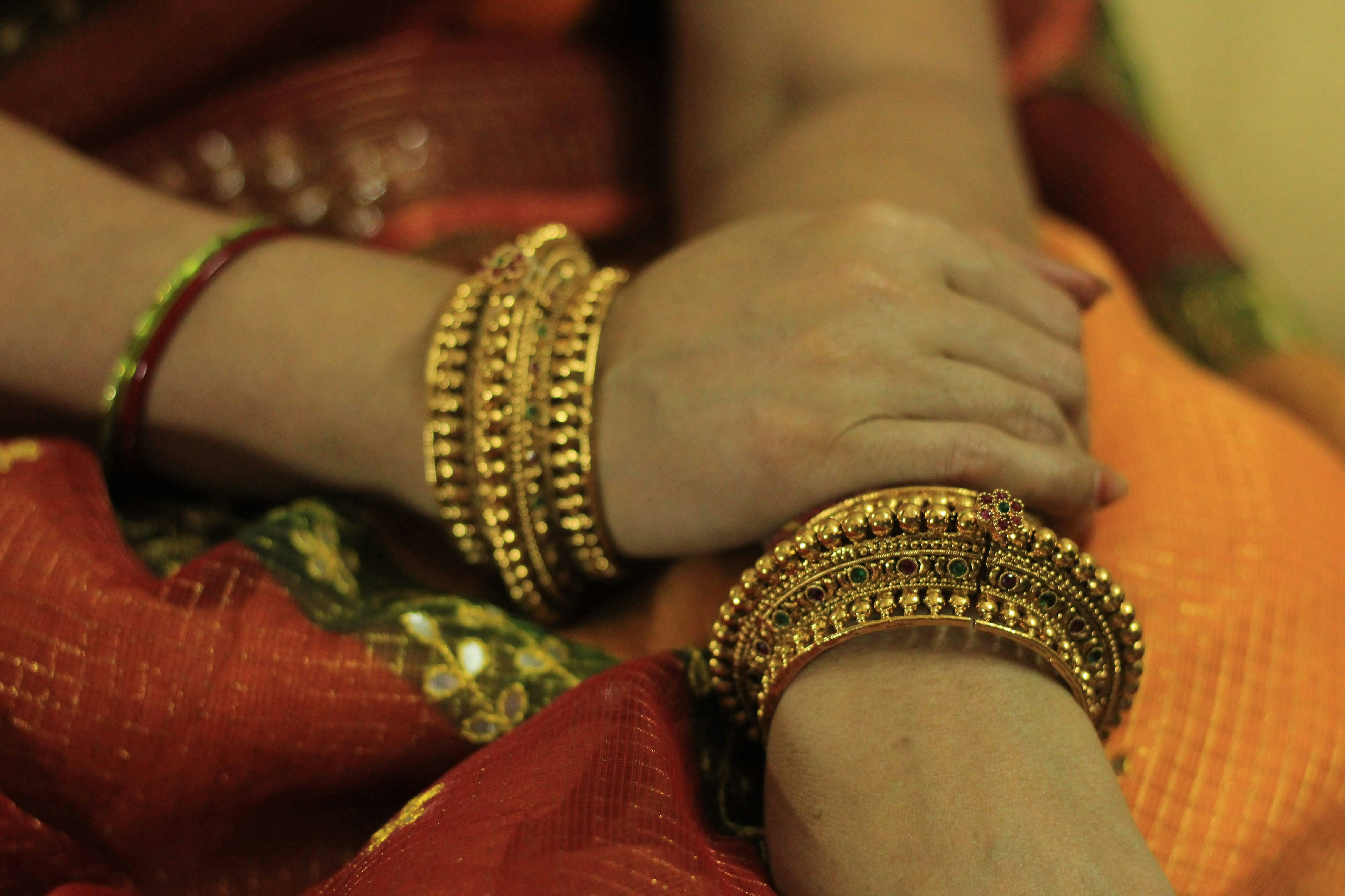 Close up of woman's hands with elegant bracelets
