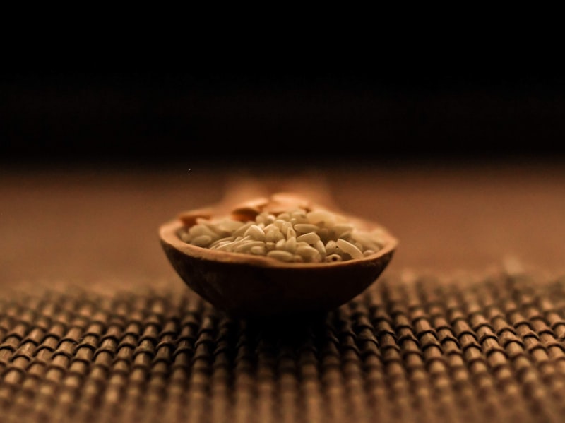 Wooden spoon with warm grains — Aditya Sethia on Unsplash
