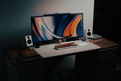 A desktop computer sitting on top of a wooden desk