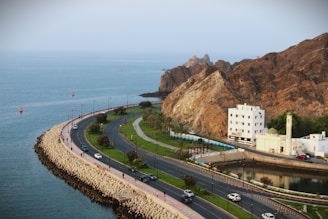 An aerial view of a highway near a body of water
