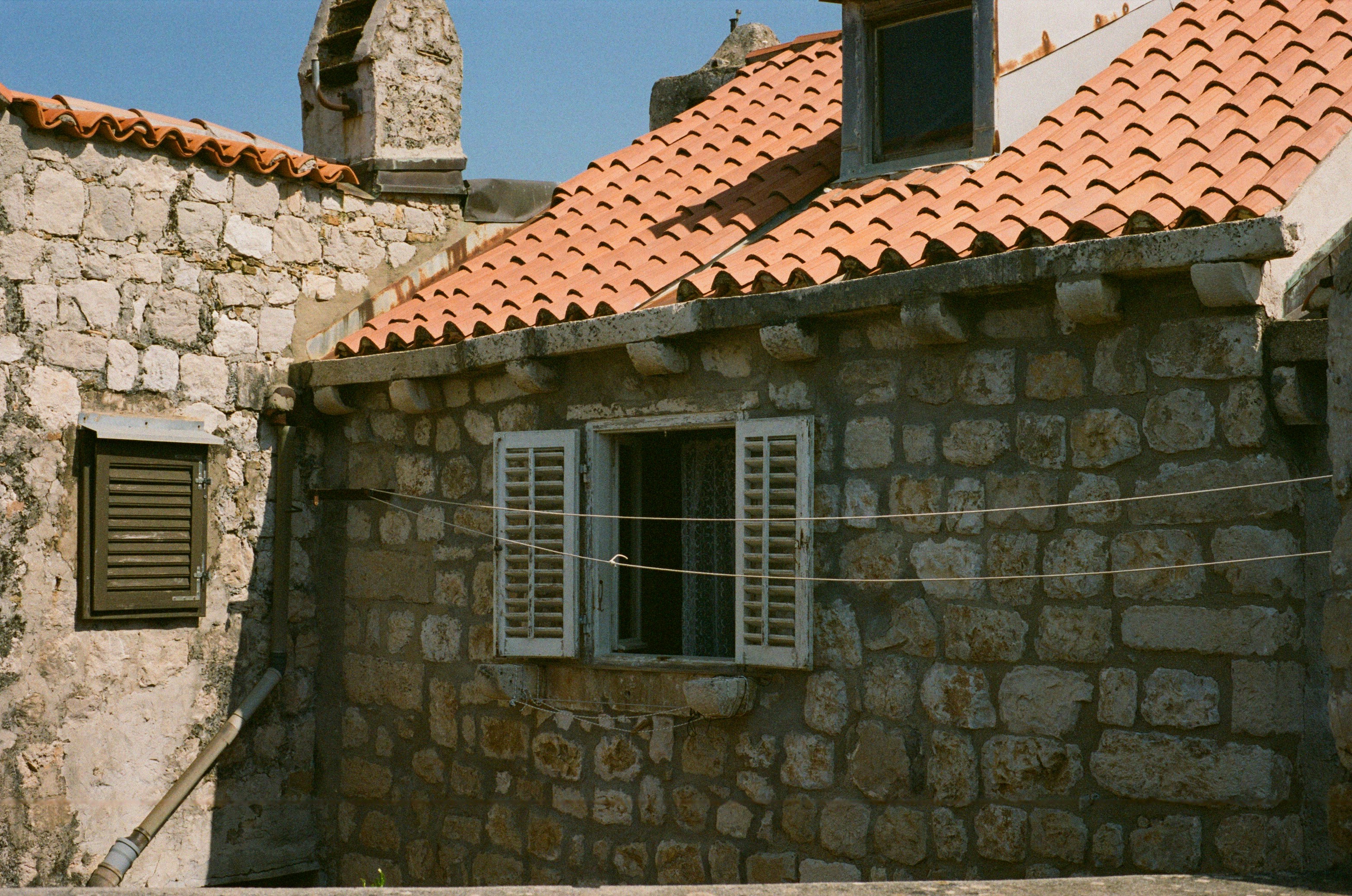 A stone building with a clock tower on top of it