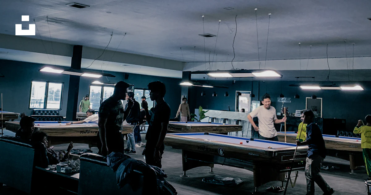 Group Standing Pool A group of people standing around a pool table photo – Free People ...