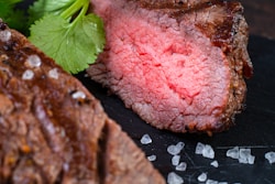 A close up of a piece of meat on a plate