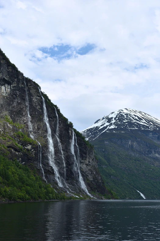 A mountain with a waterfall in the middle of it