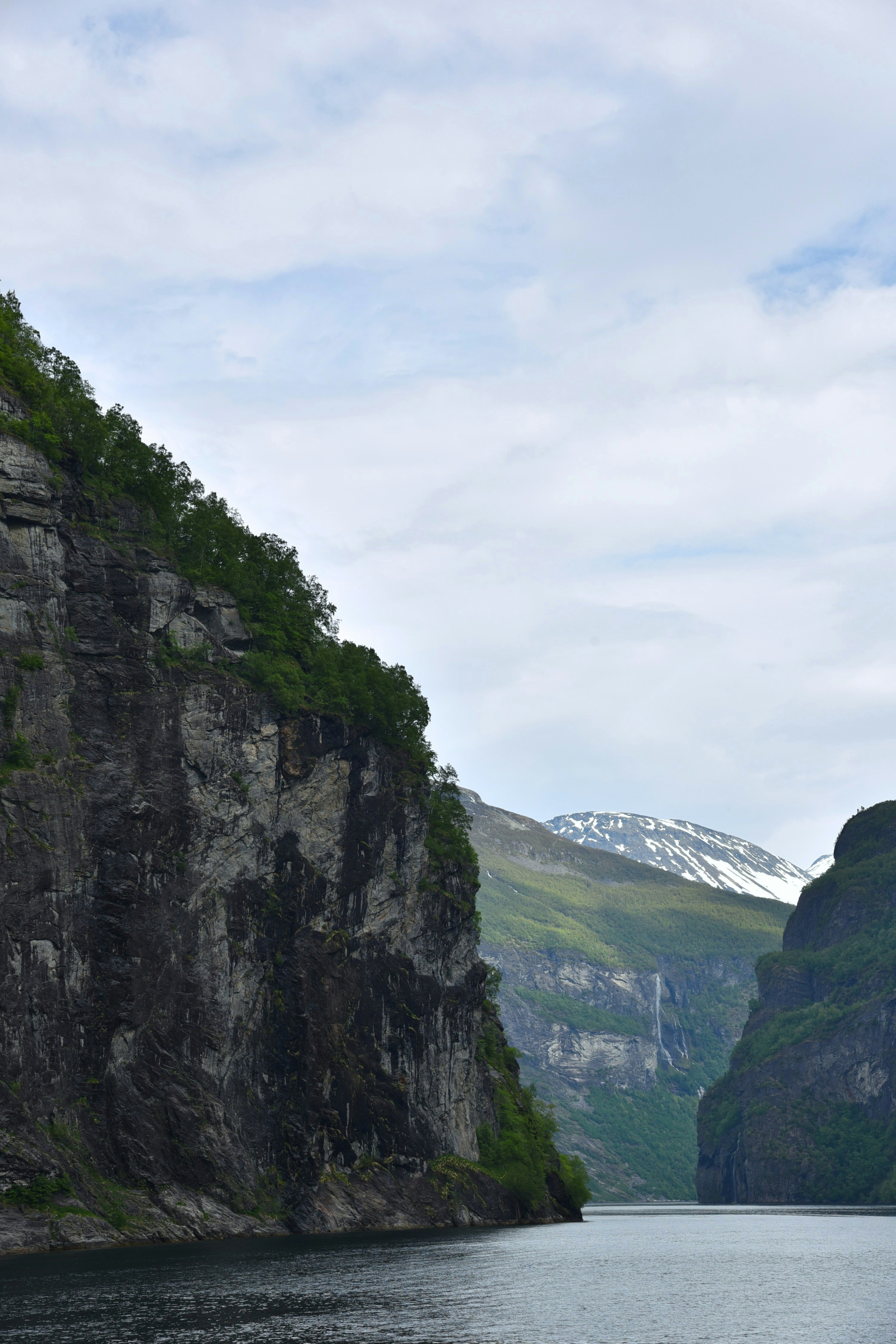 A large body of water surrounded by mountains