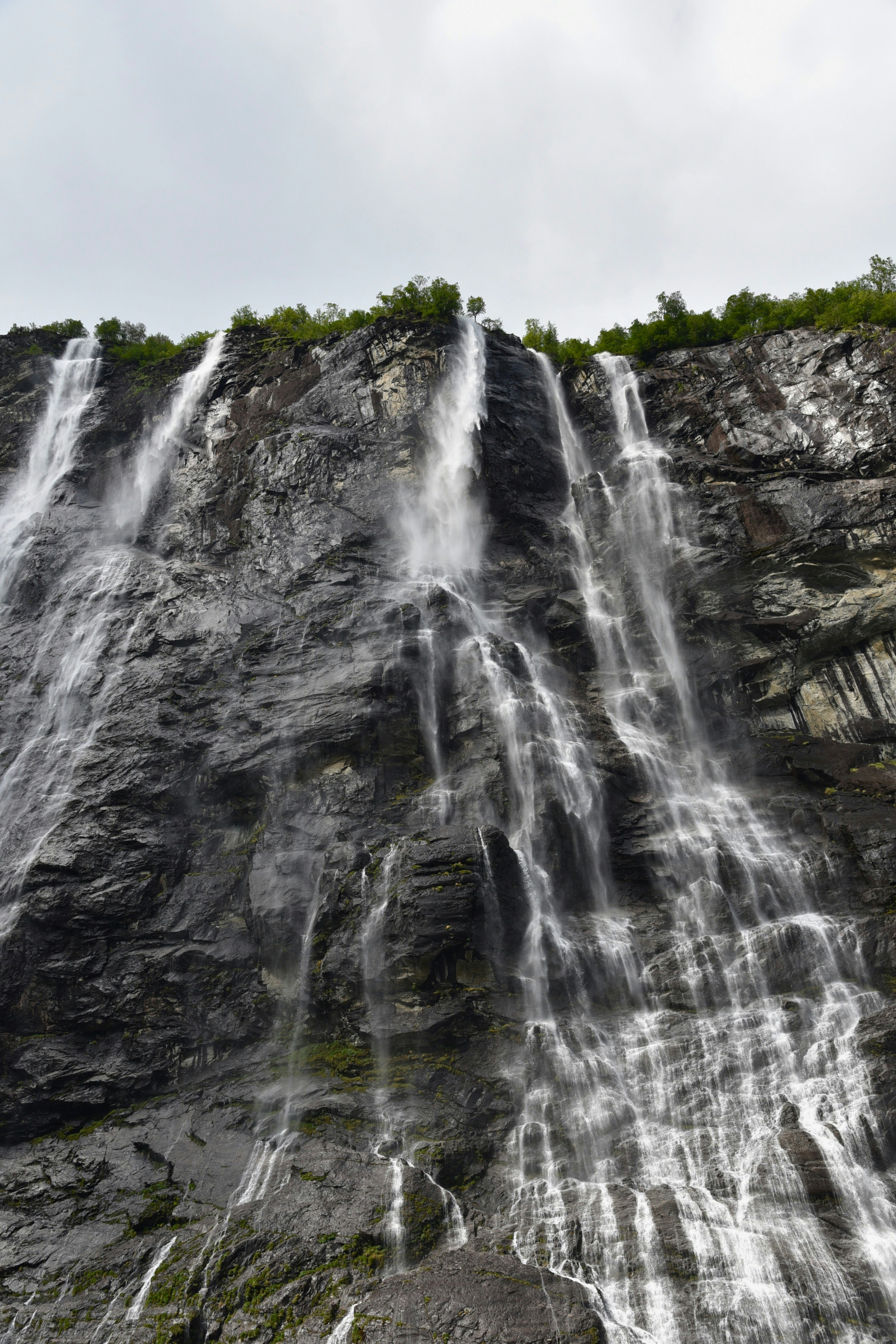 A large waterfall with lots of water coming out of it