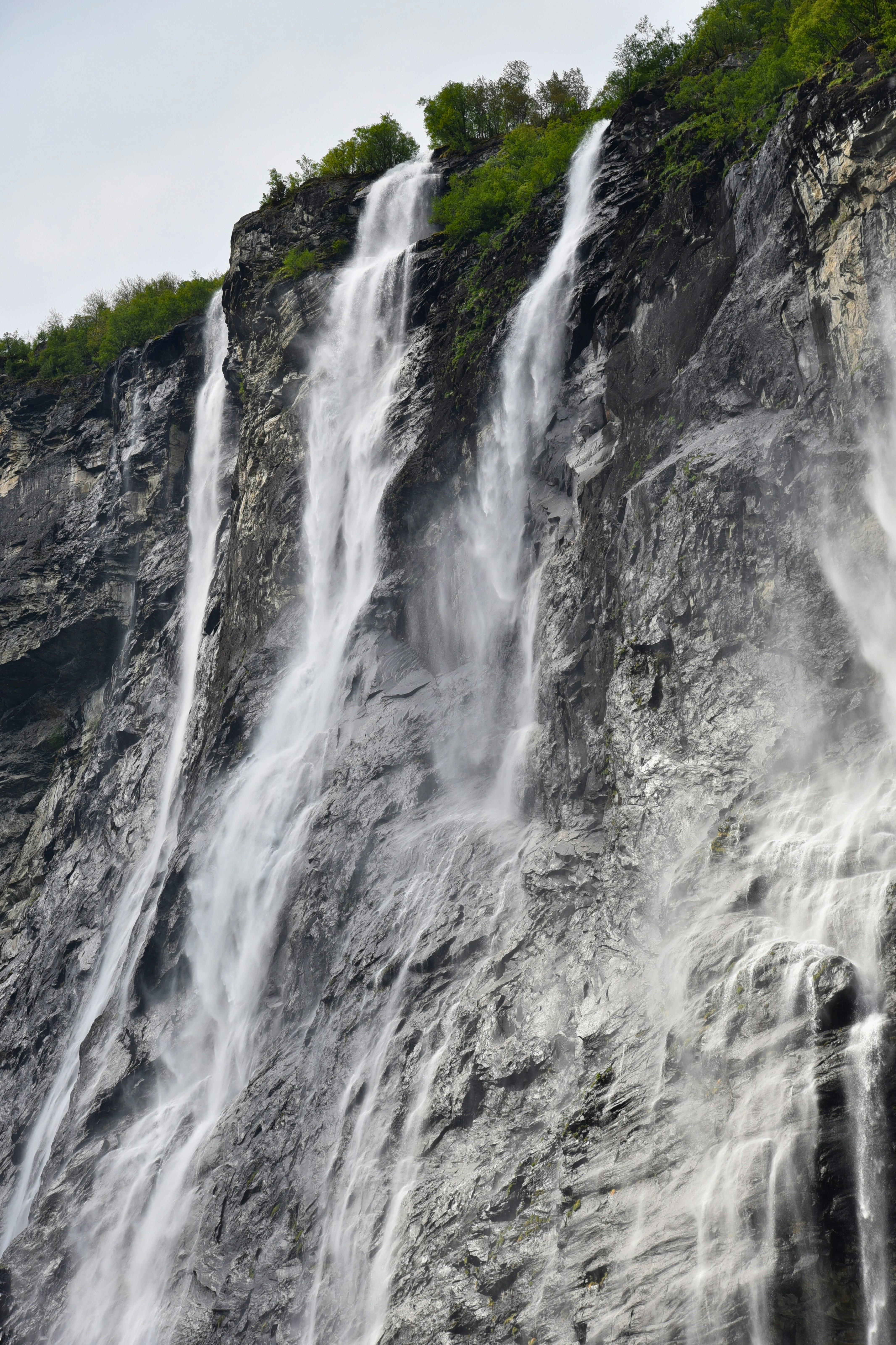 A large waterfall with lots of water coming out of it