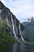A large waterfall cascading into the side of a mountain