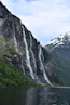 A large waterfall cascading into the side of a mountain
