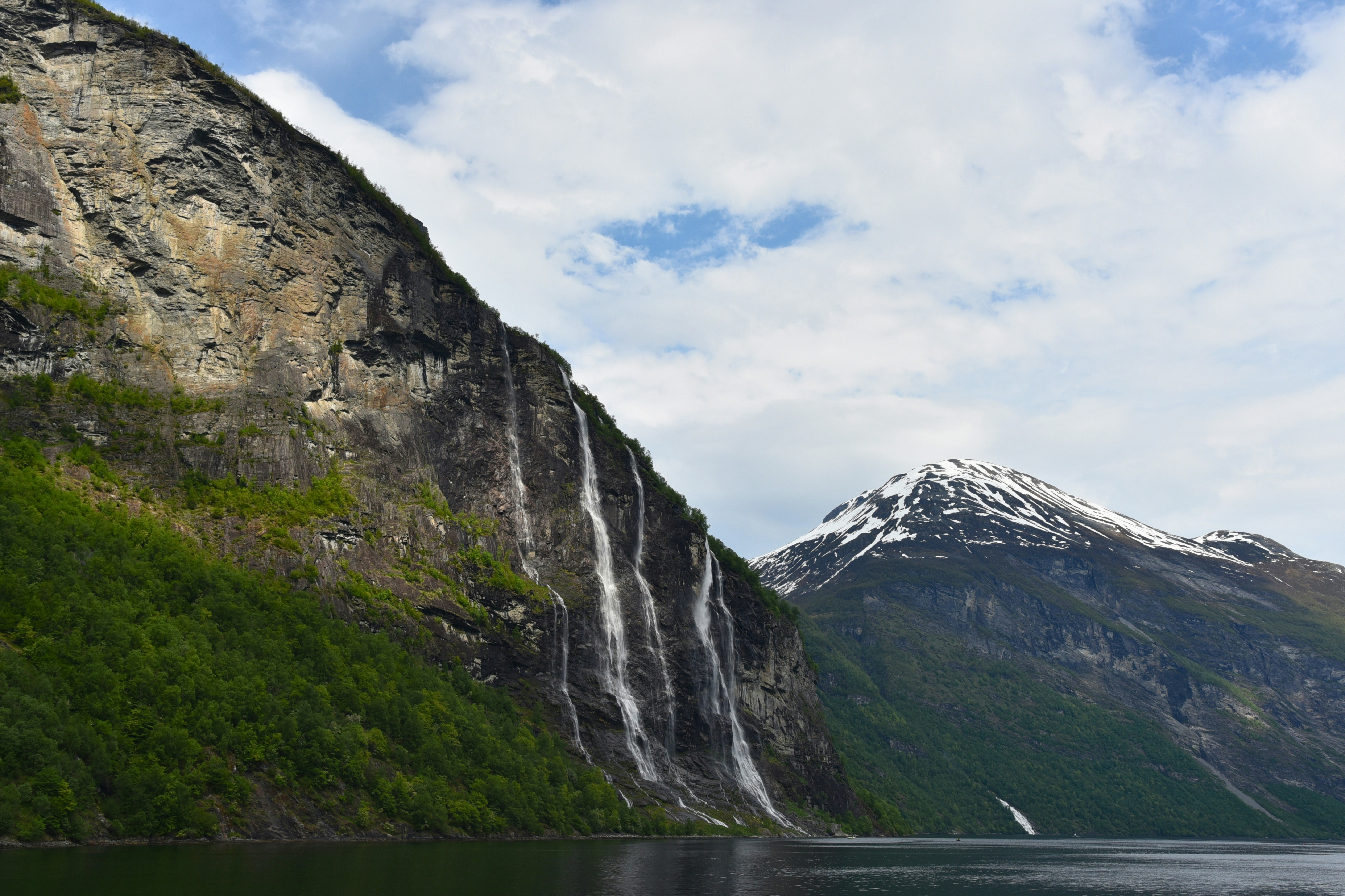 A large body of water surrounded by mountains