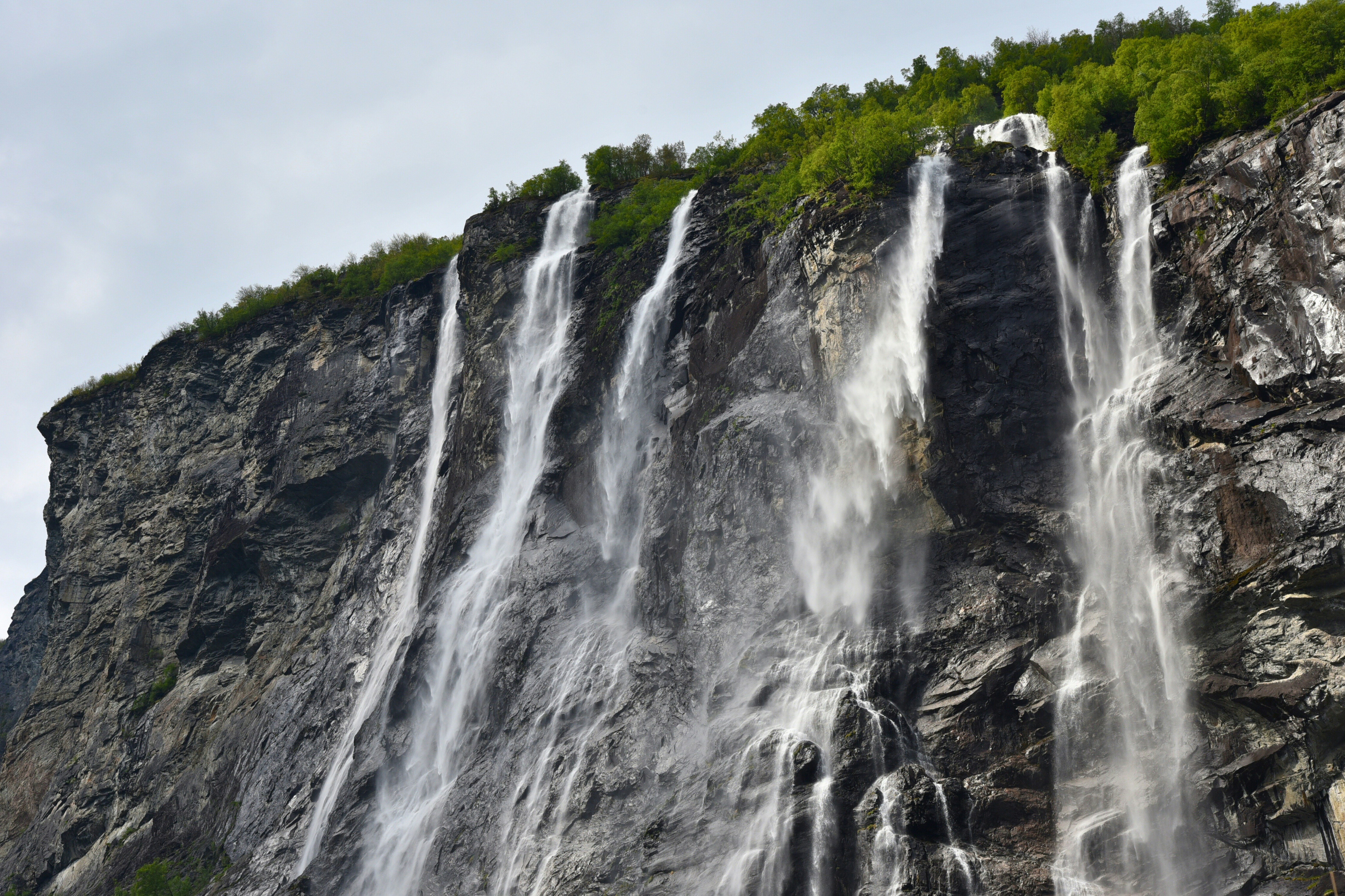 A large waterfall with lots of water coming out of it