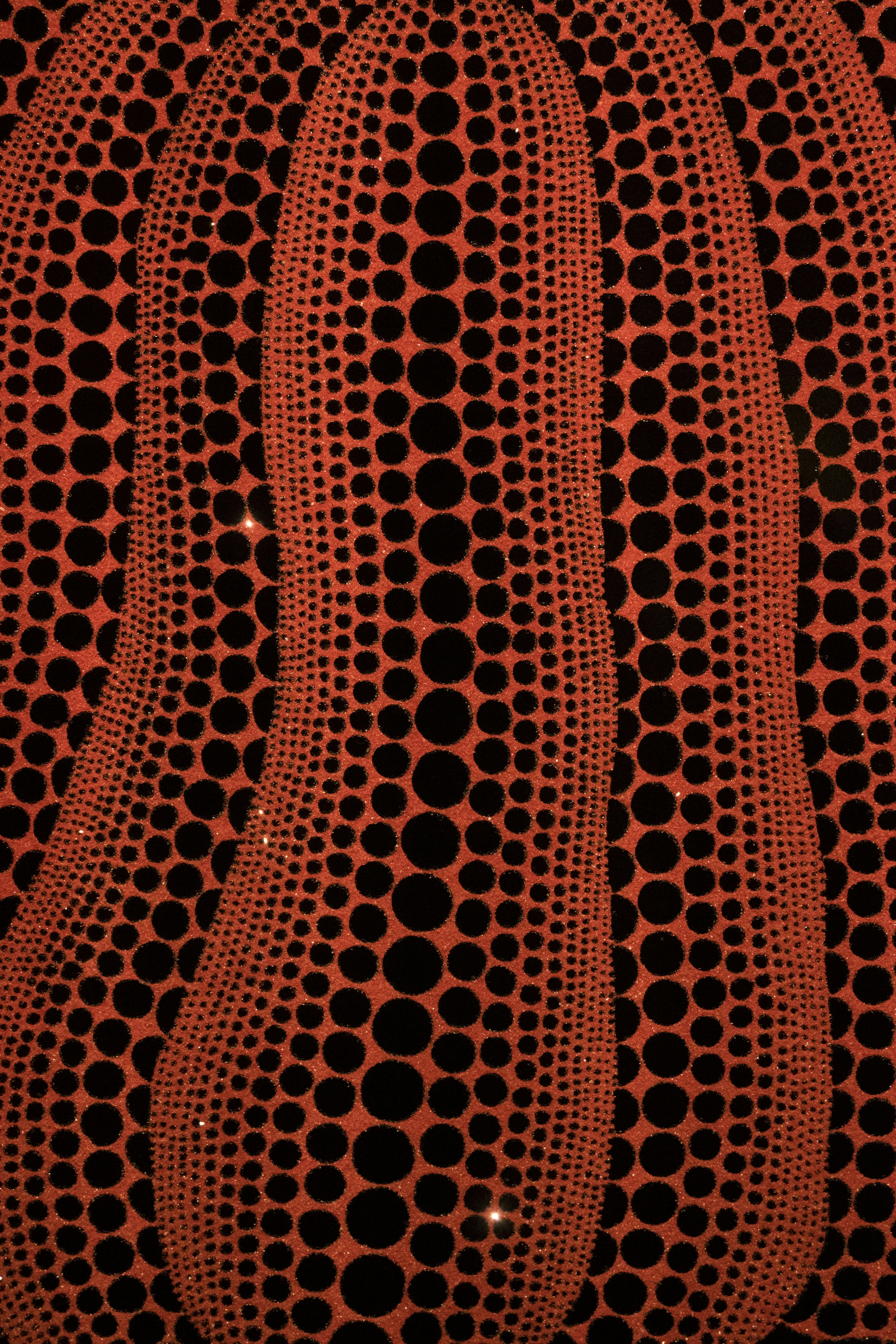 An orange and black object with circles on it