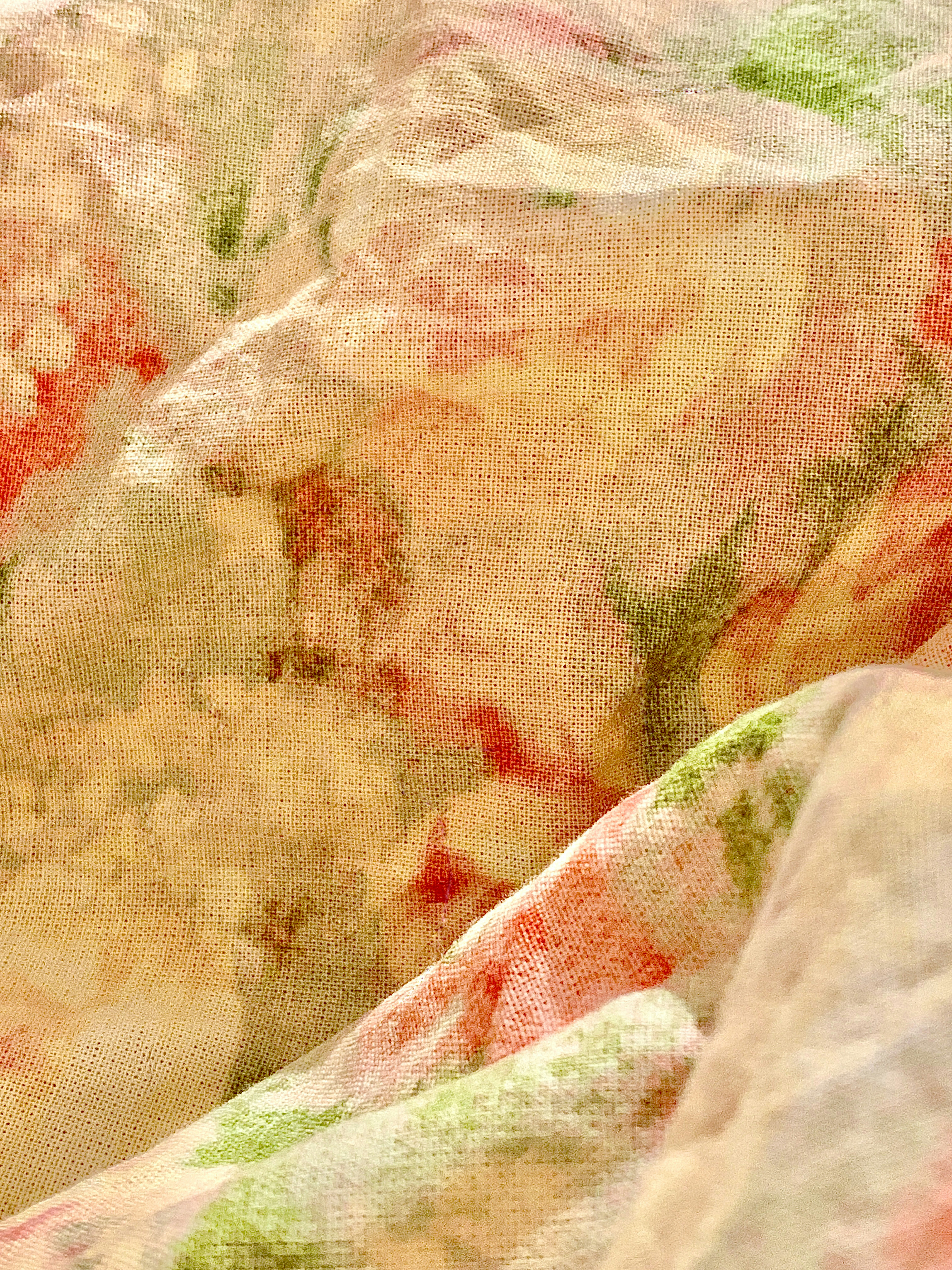 A close up of a pink and green fabric