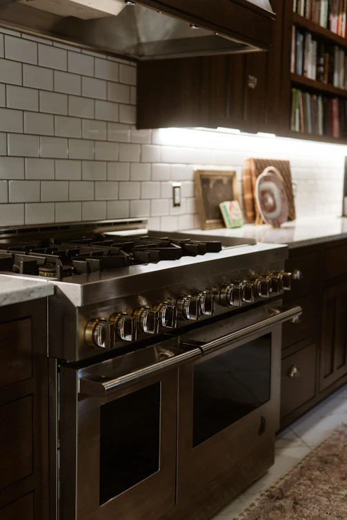 A stove top oven sitting inside of a kitchen